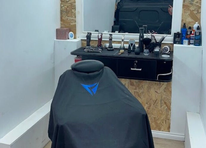 Barber chair and tools at Vivid Mobile Barbers in Folkestone, England, GB, reflecting a modern grooming setup.