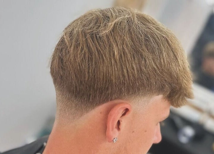 Close-up of a modern haircut with a clean fade at Vivid Mobile Barbers, Folkestone, England, GB.