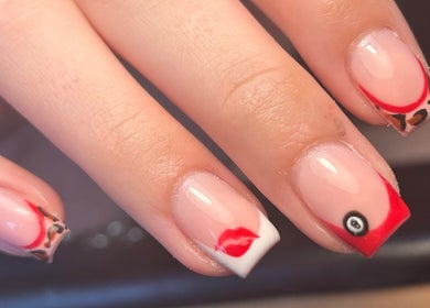 Unique nail art at Beauty by Lilly Mae, Stanton Hill, England, GB showcases playful red and leopard print design.