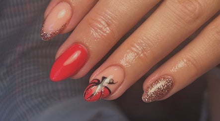 Stylish glitter and red nail art at Beauty by Lilly Mae, Stanton Hill, England, GB.