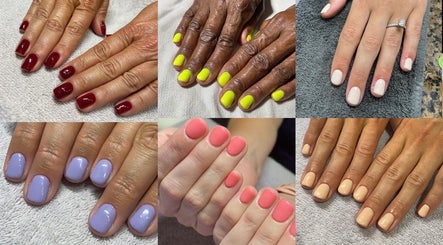 Colorful nail art at Tiffani Blu Studios, Atlanta, Georgia, US. Featuring red, yellow, and pastel shades.