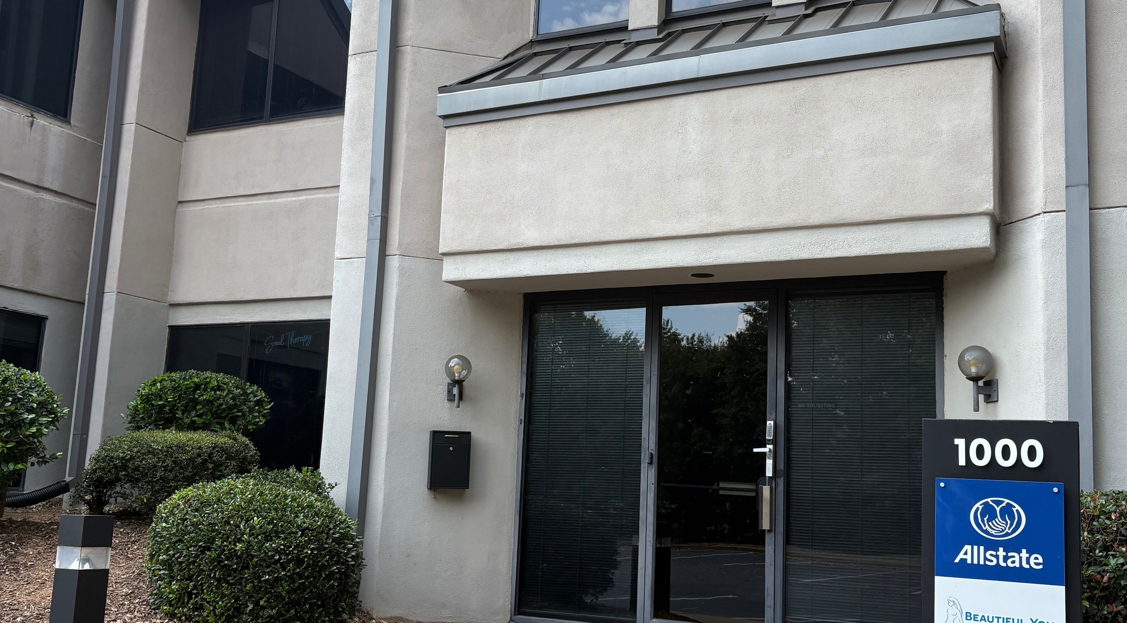 Entrance of Tiffani Blu Studios in Atlanta, Georgia, US with modern facade and greenery.