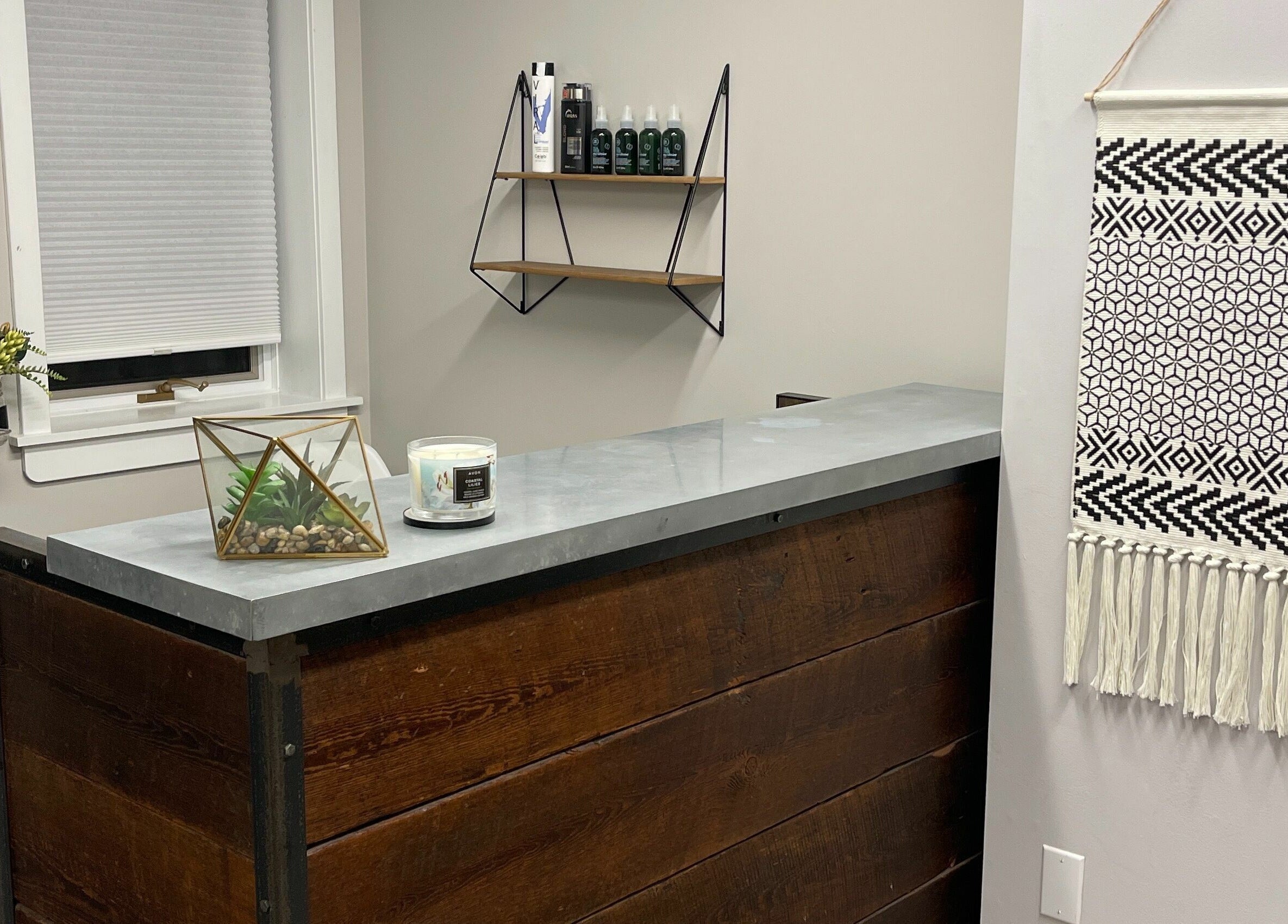 Chic reception area at 66B Salon Meg B and Alicia C, Easthampton, Massachusetts, US, featuring stylish decor.