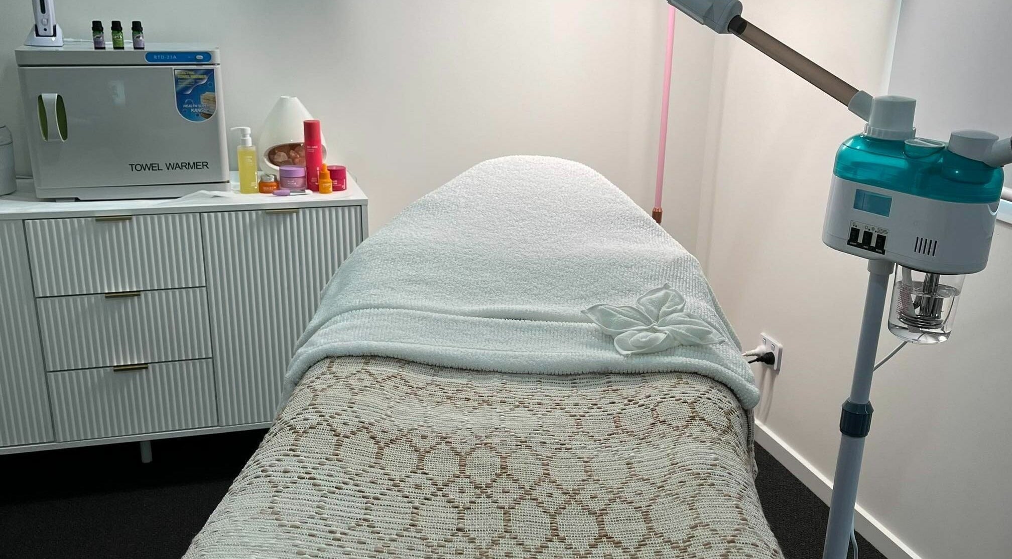 A serene treatment room at The Beauty Room Banya in Banya, Queensland, AU with a cozy bed and spa equipment.