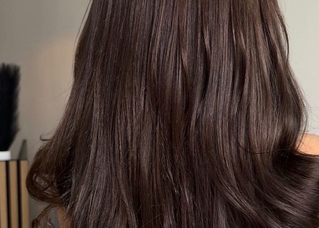 Elegant long, wavy brunette hair at Taylor Atlanta Hair, Glasgow, Scotland, GB.