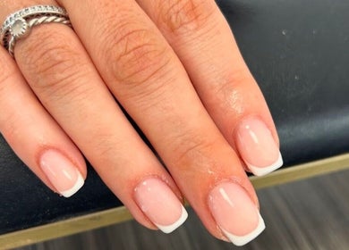 Close-up of a French manicure at Betts Beauty, Farington, England, GB showcasing detailed nail art.