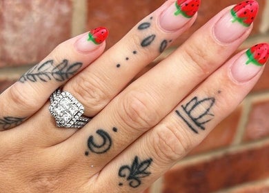 Strawberry-themed nail art at Betts Beauty, Farington, England, GB, showcasing colorful and creative designs.