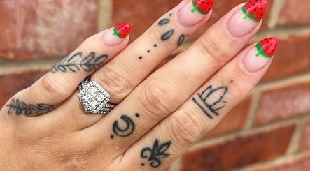Strawberry-themed nail art at Betts Beauty, Farington, England, GB, showcasing colorful and creative designs.