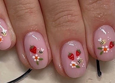 Elegant strawberry and bee nail art by Betts Beauty, Farington, England, GB.