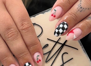 Creative cherry and checkered nail art at Betts Beauty in Farington, England, GB.