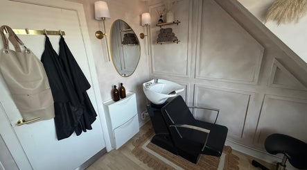 Elegant hair station at House of RC Hair, Garforth, England featuring a modern sink and stylish decor.