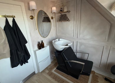 Stylish washing station at Hairology By Rosie, Garforth, England, GB, featuring elegant decor and cozy ambiance.