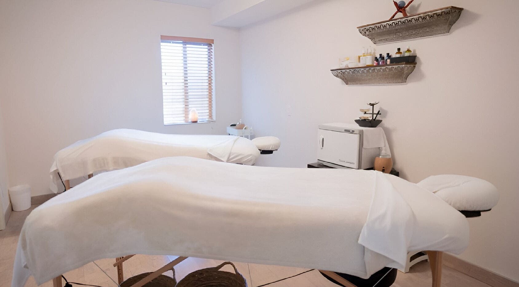 Relaxing massage room at Spirit Water Spa in Ainsworth, British Columbia, CA, featuring twin therapy beds.