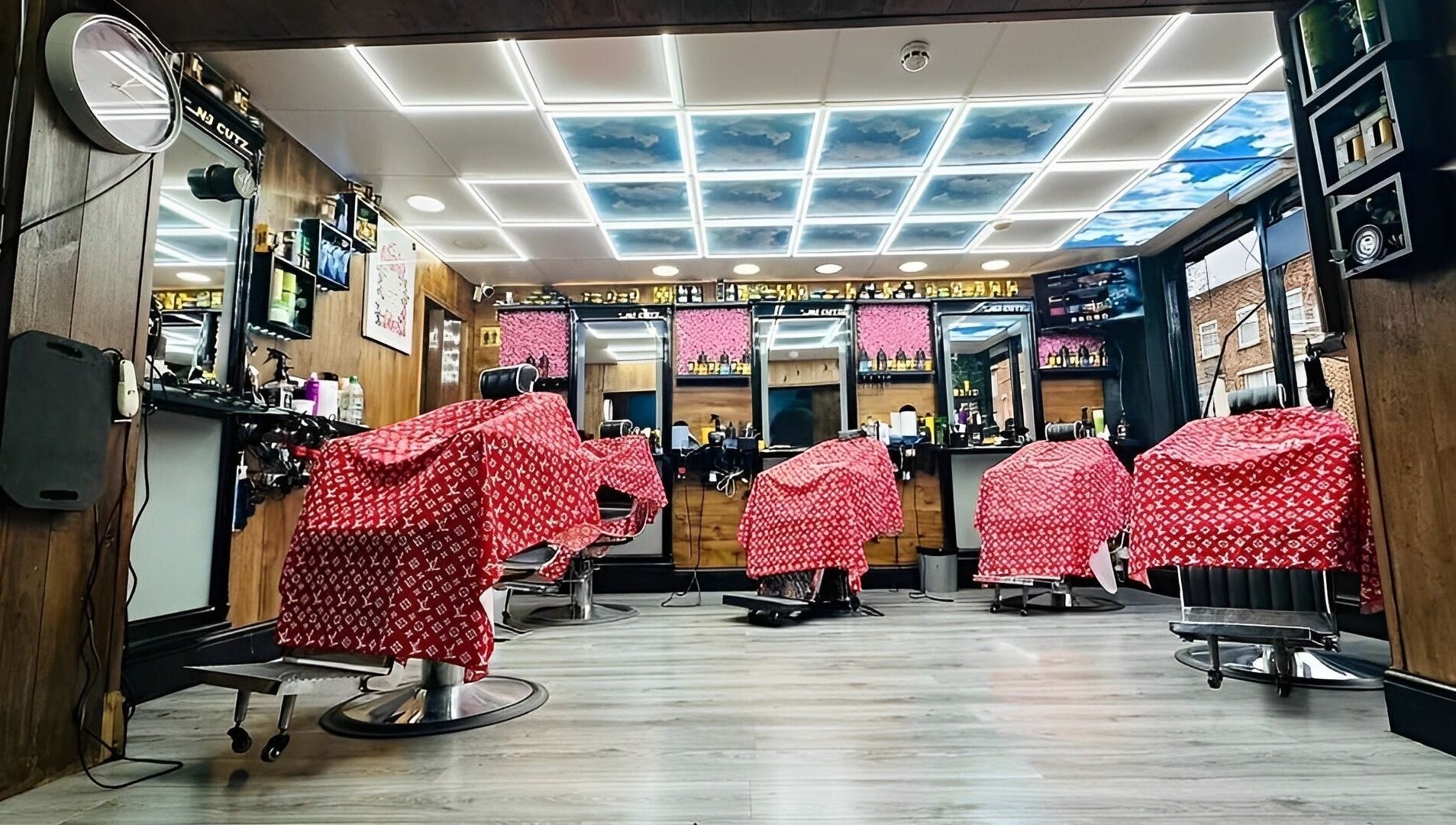 Interior of N & J Cutz in Coventry, England, GB with modern barber chairs and sleek decor.