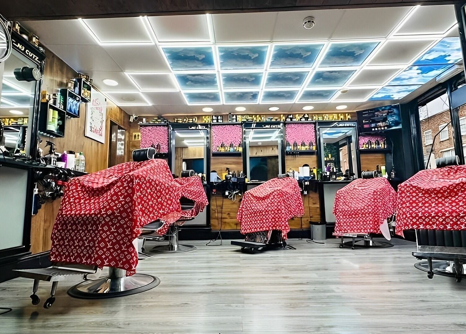Interior of N & J Cutz in Coventry, England, GB with modern barber chairs and sleek decor.