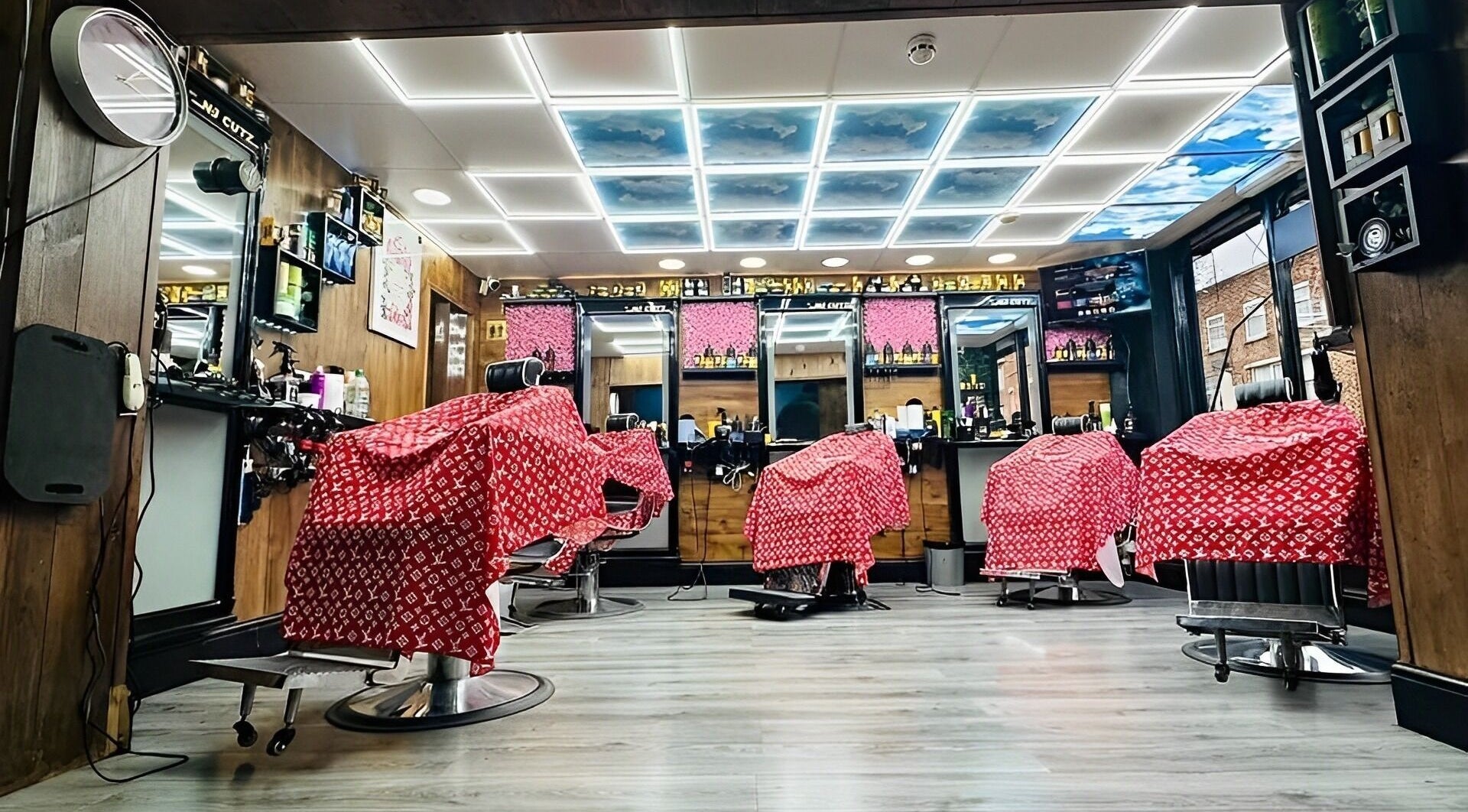 Interior of N & J Cutz in Coventry, England, GB with modern barber chairs and sleek decor.