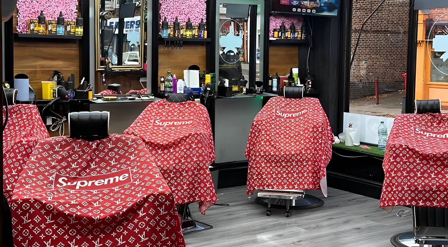 Vibrant barber chairs at N & J Cutz in Coventry, England, GB, showcasing a trendy salon setup.