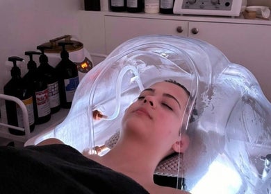 Woman enjoys hydrotherapy treatment at Art & Beauty, London, England, GB. A soothing wellness experience.
