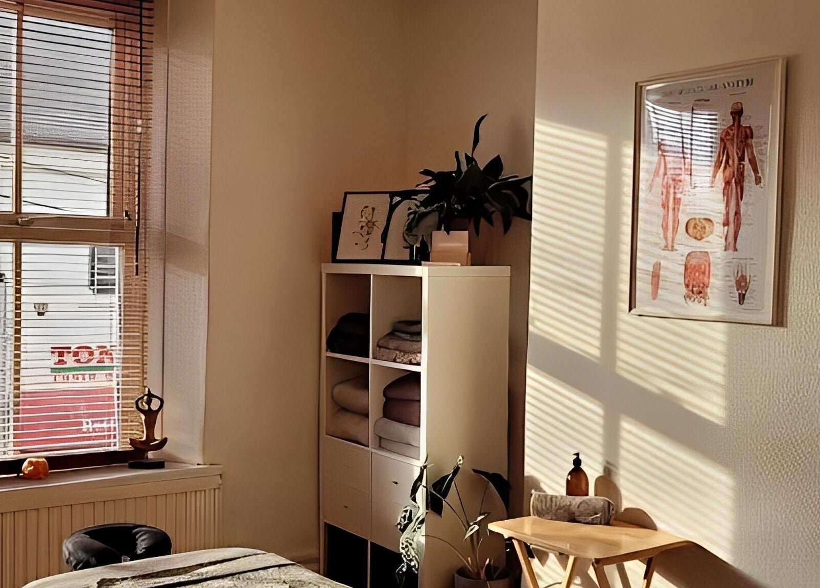 Tranquil therapy room at Bethan Owen Complementary Healthcare in Cardiff Bay, Wales, GB with sunlight filtering in.