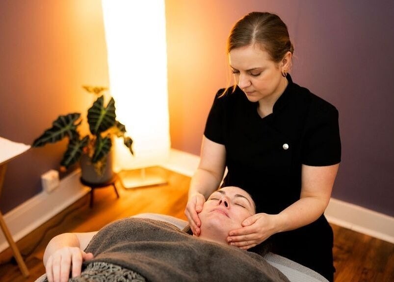 Relaxing facial massage at Bethan Owen Complementary Healthcare, Cardiff Bay, Wales, GB in a calming room.
