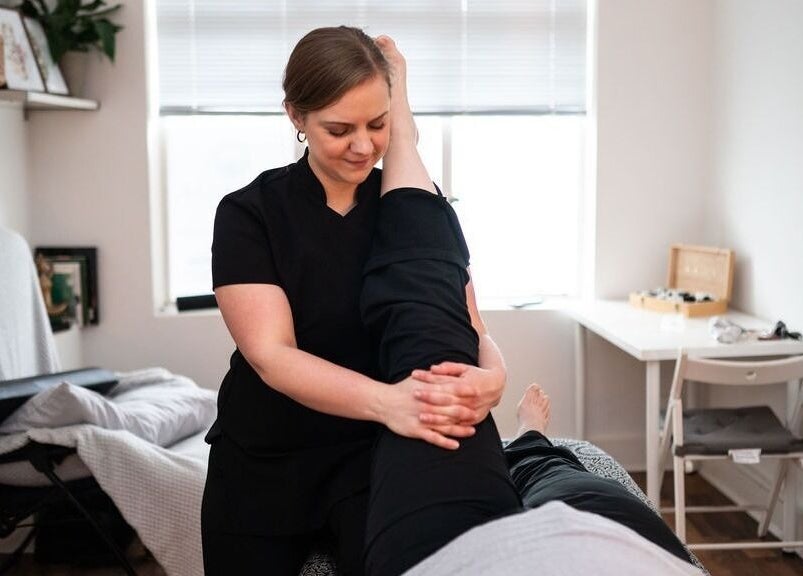 Therapist performing leg massage at Bethan Owen Complementary Healthcare, Cardiff Bay, Wales, GB.