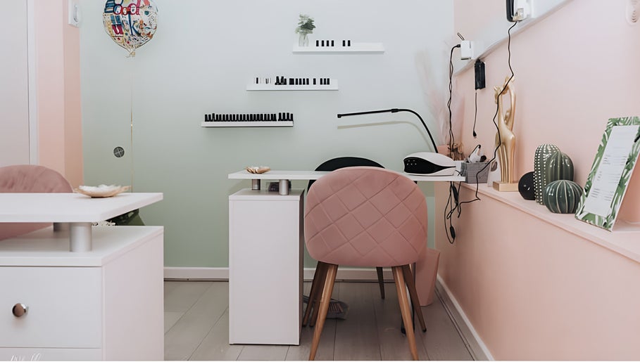 Stylish workstation at Kate Darby - Hair Designer in Stoke-on-Trent, England, GB with pink decor.