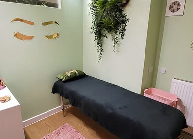 Tranquil spa room at Kate Darby - Hair Designer, Stoke-on-Trent, England, GB with green decor and a massage table.