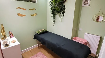 Tranquil spa room at Kate Darby - Hair Designer, Stoke-on-Trent, England, GB with green decor and a massage table.