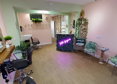 Elegant interior of Kate Darby - Hair Designer in Stoke-on-Trent, England, GB with stylish decor and seating.