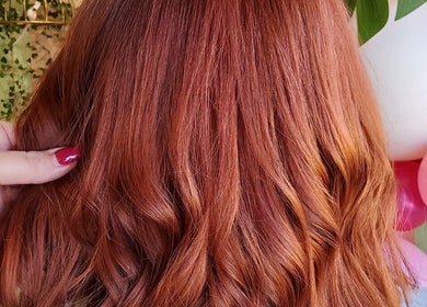 Vibrant red hair styled in waves by Kate Darby - Hair Designer, Stoke-on-Trent, England, GB.