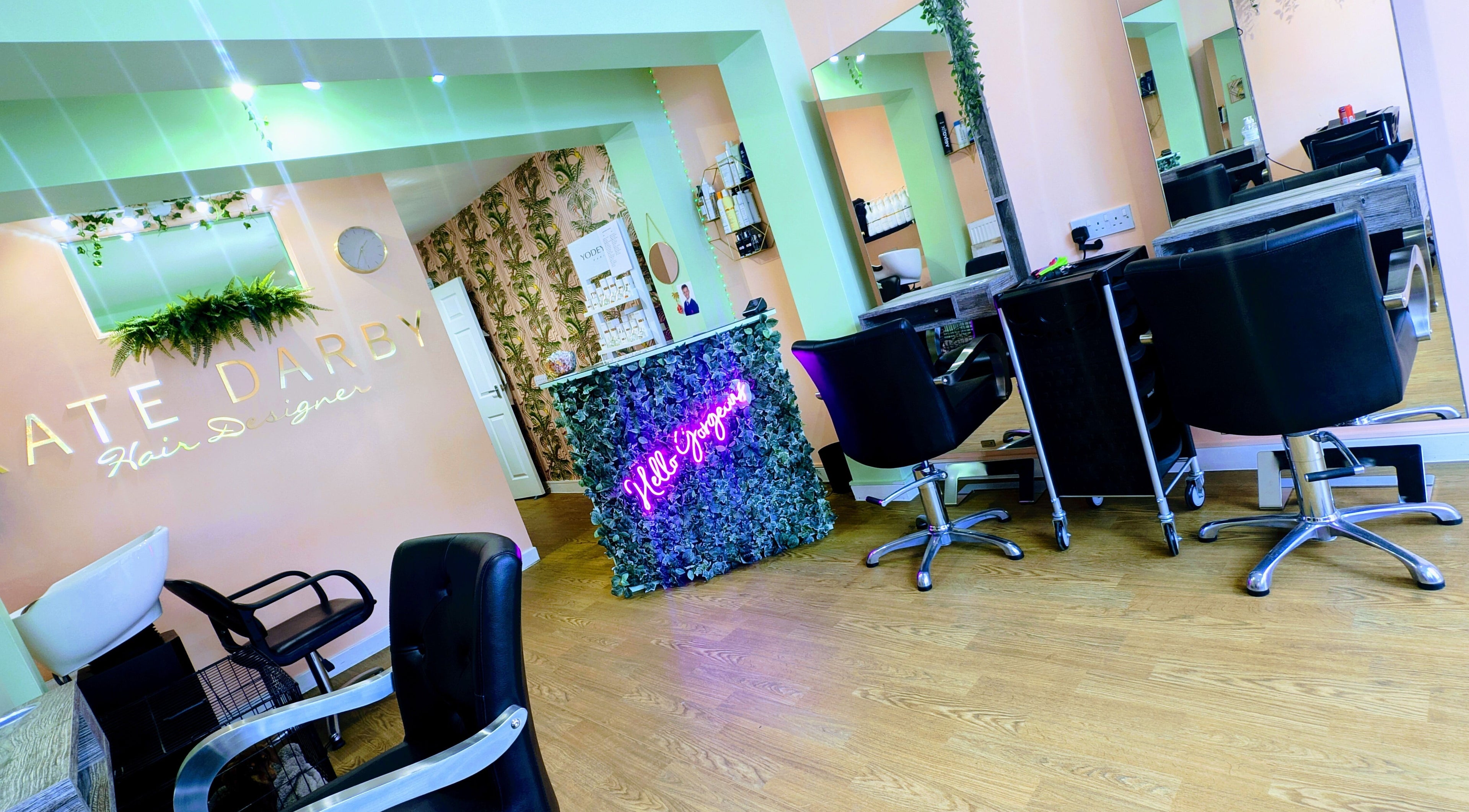 Modern interior of Kate Darby - Hair Designer in Stoke-on-Trent, England, GB, featuring chic decor and styling chairs.