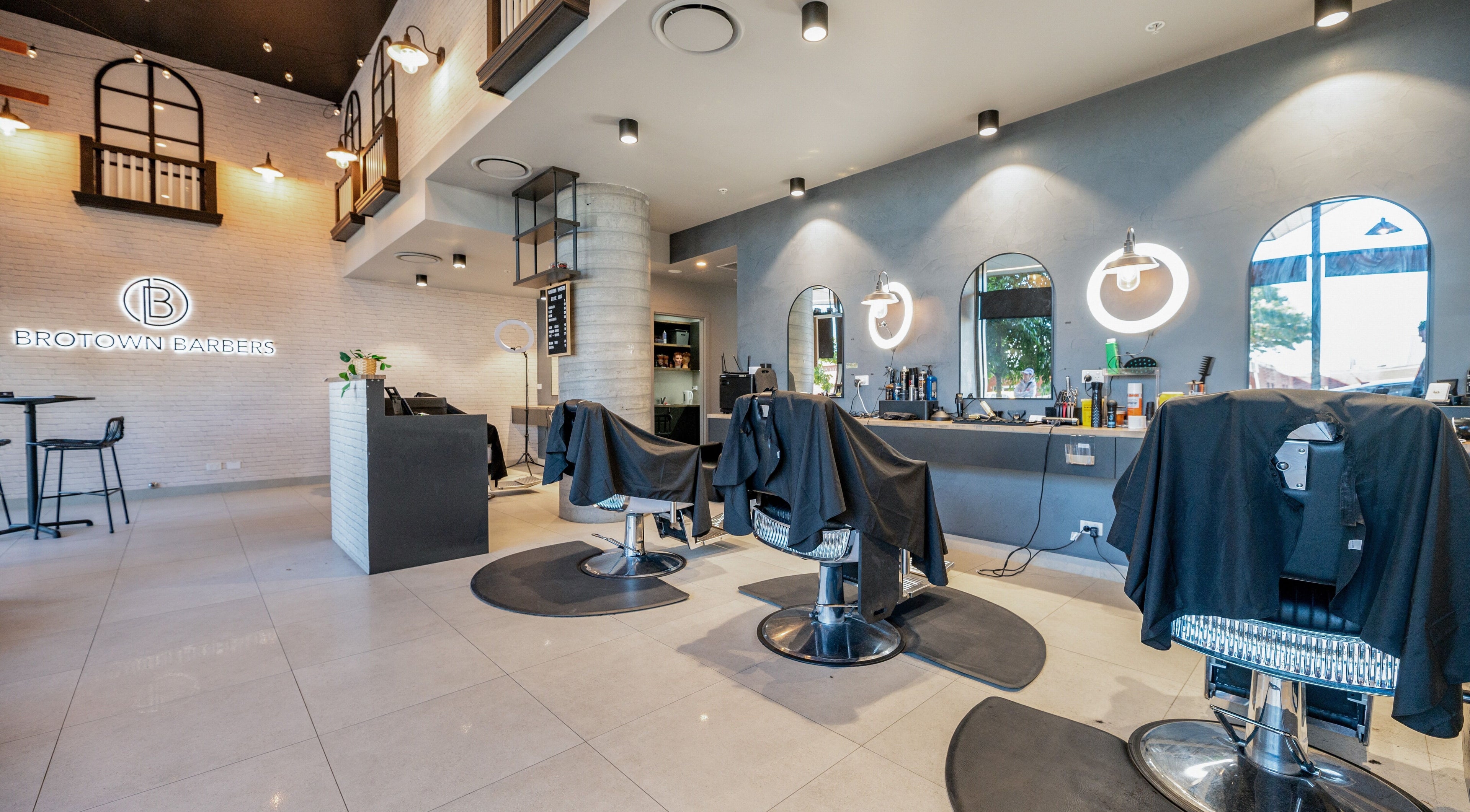 Interior of Brotown Barbers, Bowen Hills, showcases sleek chairs and modern decor.