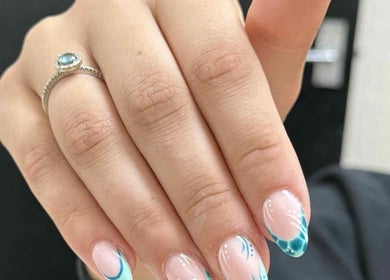 Detailed view of elegant blue nail art with intricate designs at Beauty Lounge, Bargoed, Wales, GB.