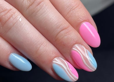 Stylish pink and blue nail art at Beauty Lounge in Bargoed, Wales, GB showcasing chic elegance.