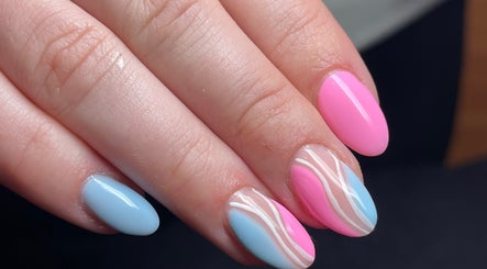 Stylish pink and blue nail art at Beauty Lounge in Bargoed, Wales, GB showcasing chic elegance.