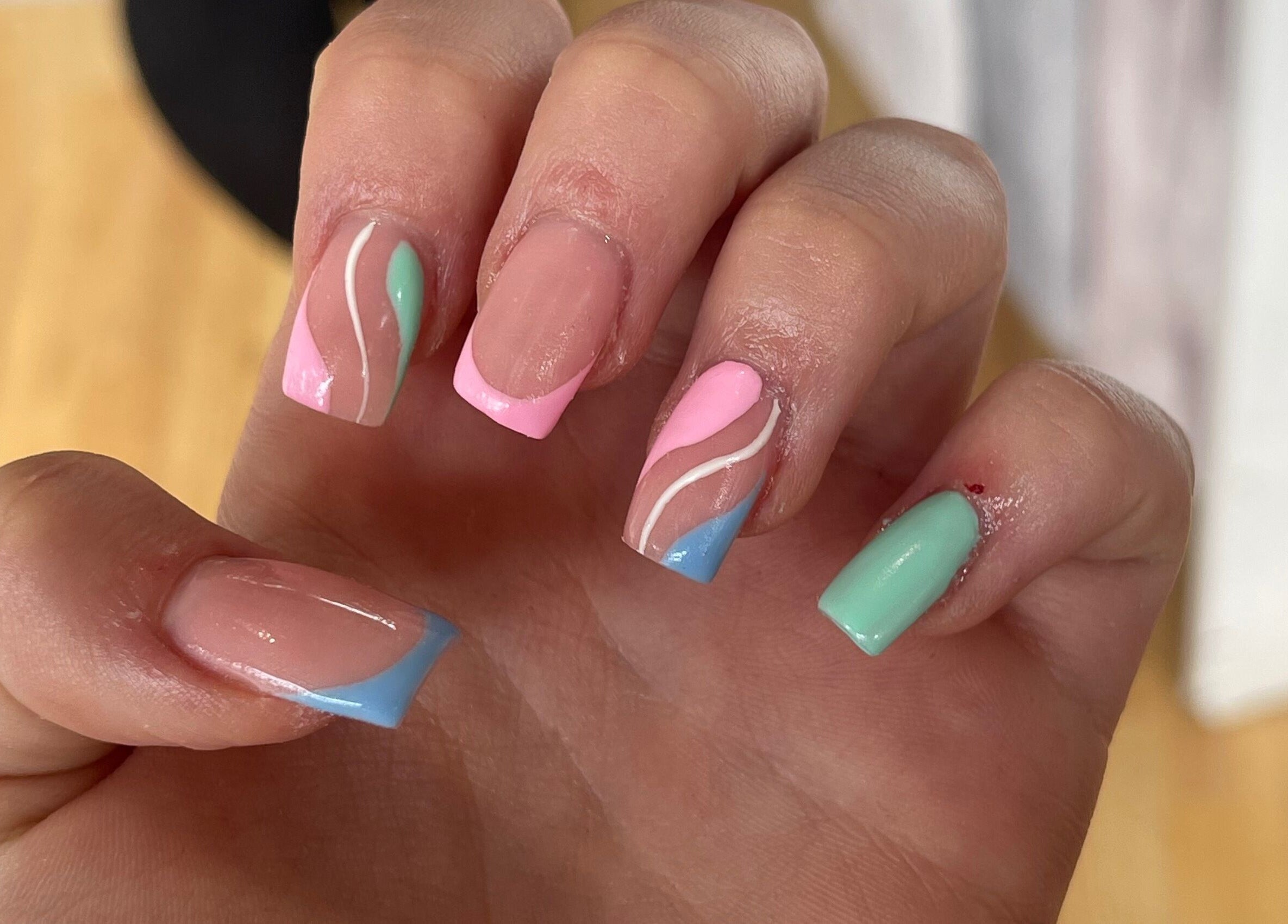 Colorful nail art by Beauty Lounge in Bargoed, Wales, GB featuring pastel designs.