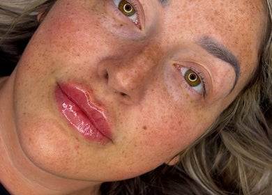 Close-up of a woman's glowing skin after treatment at LJT Aesthetics, Herne Bay, England, GB.
