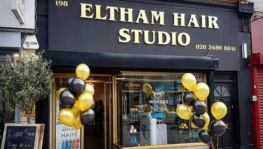 Eltham Hair Studio entrance with balloons at London, England, GB reflecting vibrant ambiance.