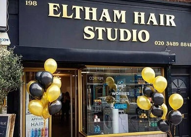 Eltham Hair Studio entrance with balloons at London, England, GB reflecting vibrant ambiance.