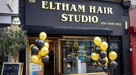 Eltham Hair Studio entrance with balloons at London, England, GB reflecting vibrant ambiance.