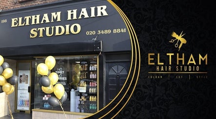 Eltham Hair Studio entrance in London, England, GB, with stylish black and gold design and decorative balloons.