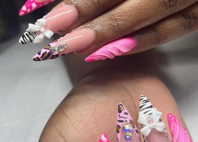 Vibrant pink and animal print nails at The Glory House, Nassau, New Providence, BS.
