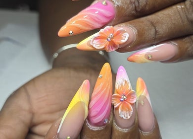 Vibrant floral nail art on display at The Glory House, Nassau, New Providence, BS.