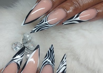 Stylish zebra-patterned nails design at The Glory House in Nassau, New Providence, BS.