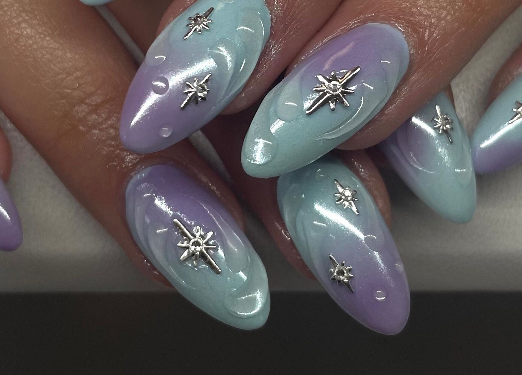 Elegant nail art with star accents at A Dose of Sof, Vancouver, British Columbia, CA.