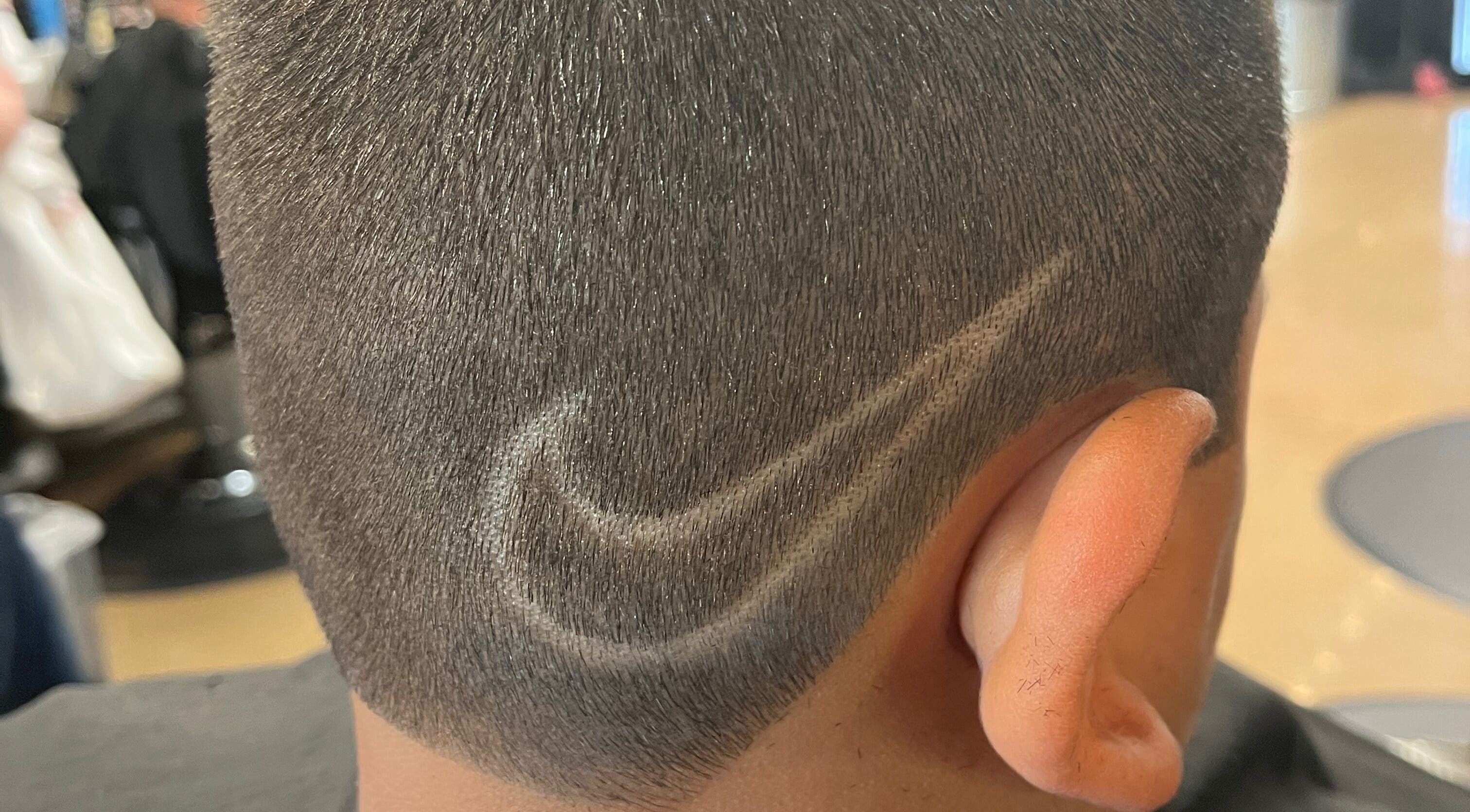 Close-up of a unique hair design at Studio M, Euless, Texas, US, showcasing expert precision.