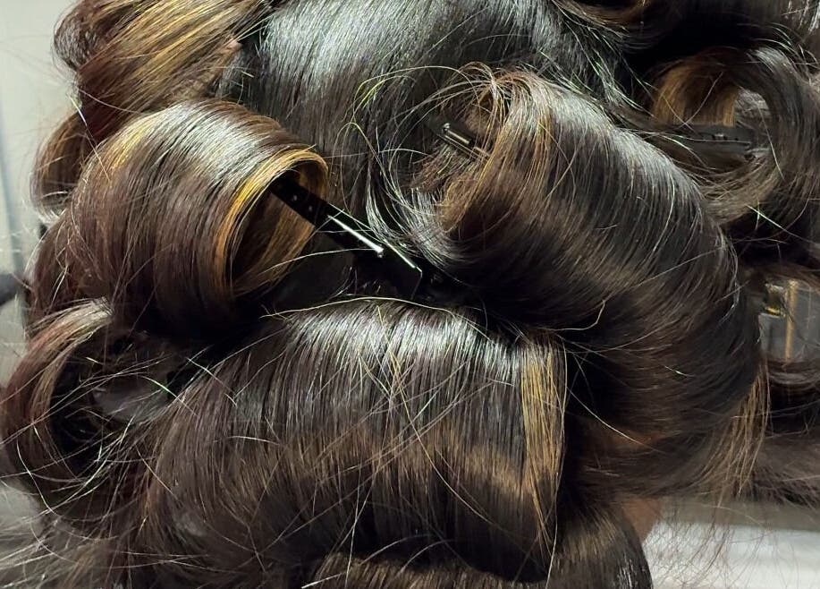 Luxurious curly hairstyle at Studio M in Euless, Texas, US showcasing expert styling.