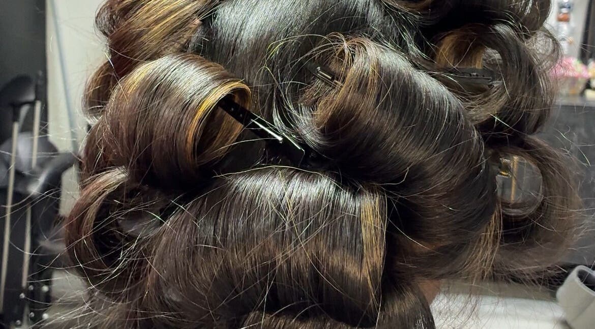 Luxurious curly hairstyle at Studio M in Euless, Texas, US showcasing expert styling.