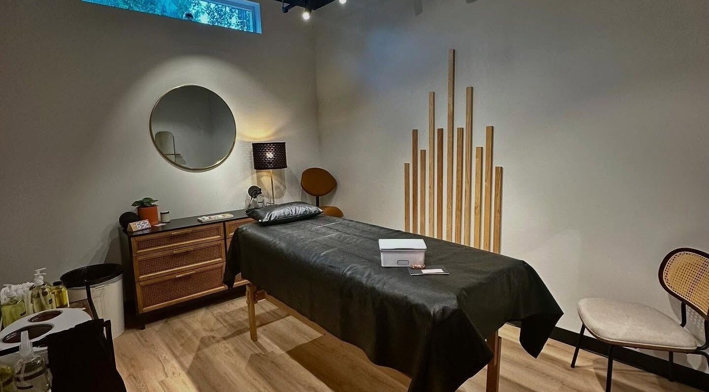 Calming room at Neighborhood Wax, Denver, Colorado, US, featuring a massage table and soothing decor.