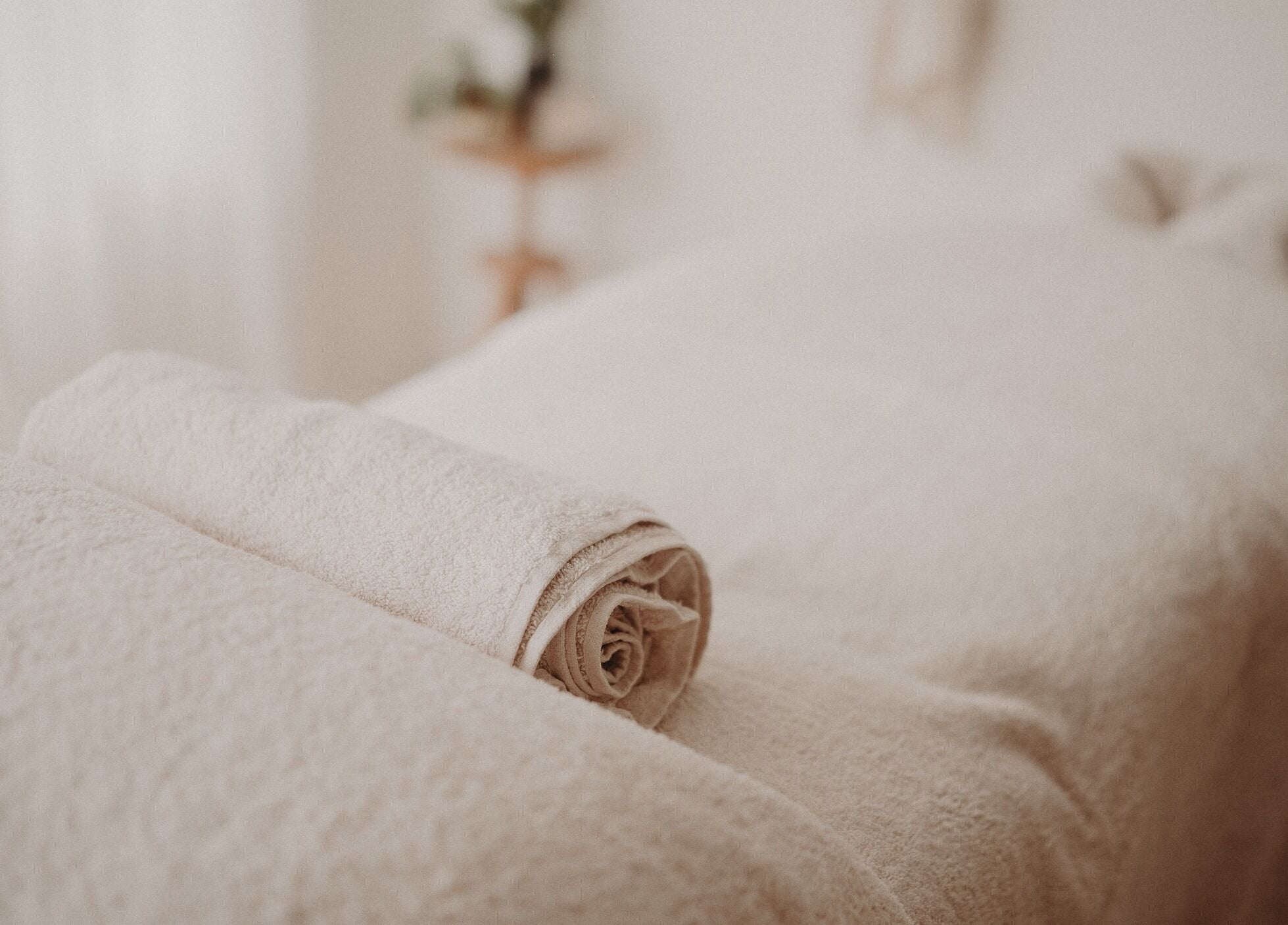 Relaxing massage table setup at Nurture Massage, Byron Bay, New South Wales, AU, with folded towels.